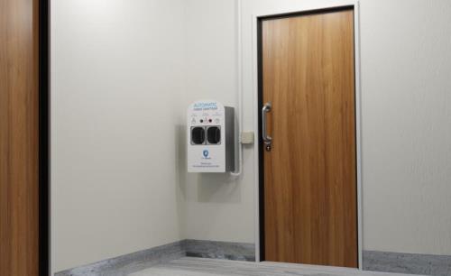 Sanitizer-integrated access control to provide extra care from COVID-19